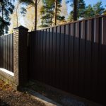 Garden,Fencing.,A,Metal,Fence,With,A,Sliding,Door,Fixed
